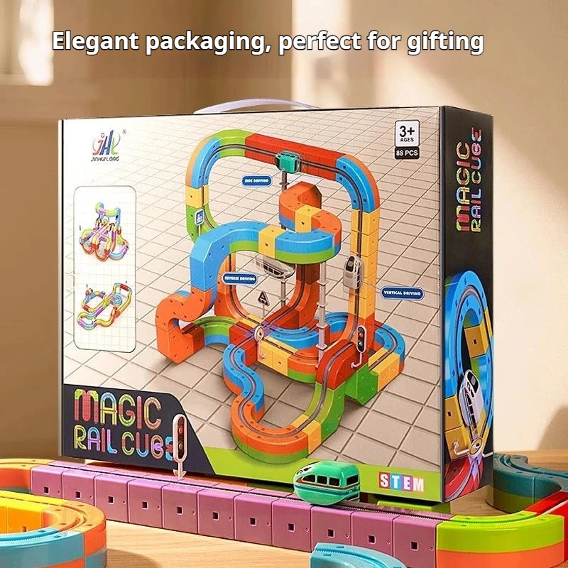 Magic Rail Cube toy set packaging with colorful rail system and toy car on a wooden surface.